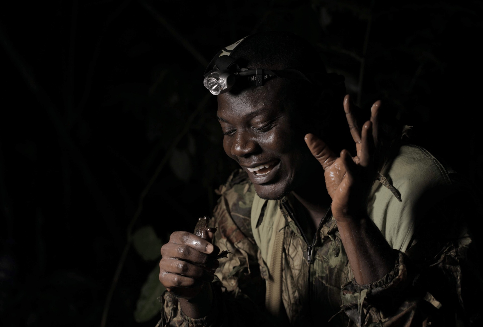 Guardian Caleb Ofori, from Herp Conservation Ghana, with Togo Slippery Frog.