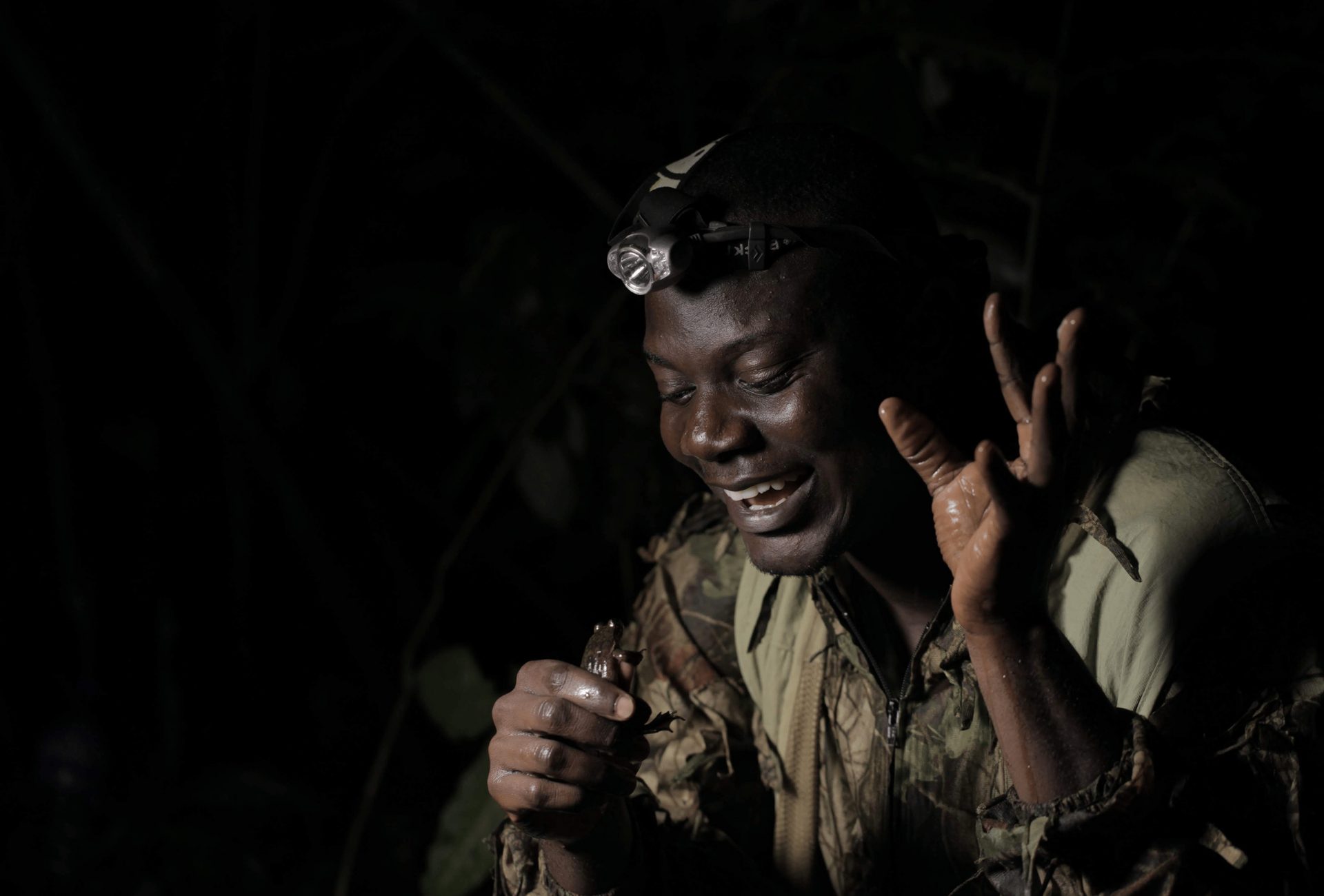 Guardian Caleb Ofori, from Herp Conservation Ghana, with Togo Slippery Frog.