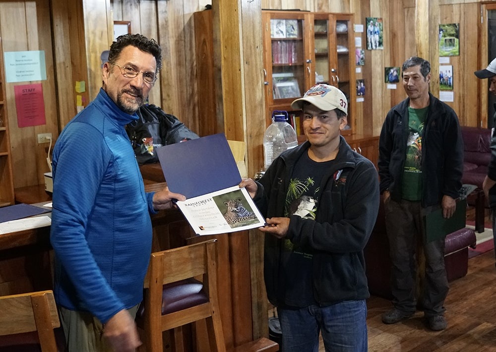 Mark presents a Certificate of Appreciation to a Guardian of the Rainforests.